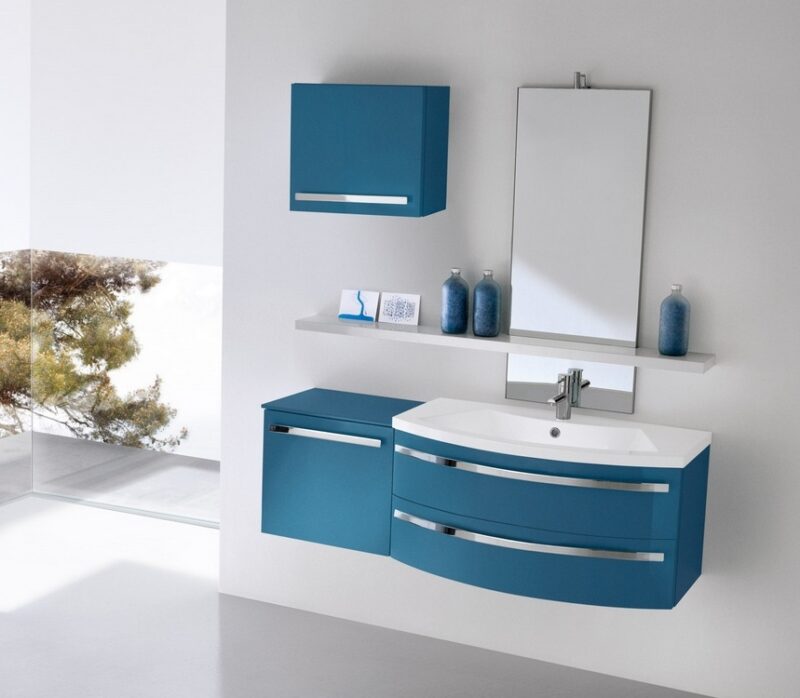 Mobile bagno curvo Compab CH 11 con base portalavabo a due cassetti e lavabo in Mineralmarmo.
