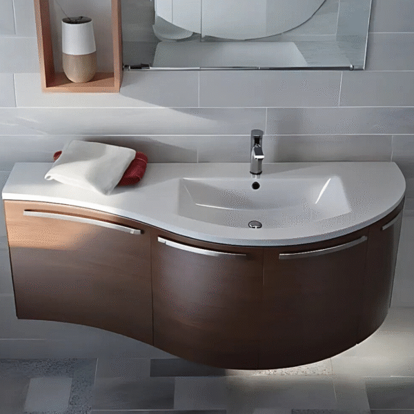 Mobile bagno sospeso in legno scuro, lavabo integrato, asciugamani, specchio, mensola decorativa.