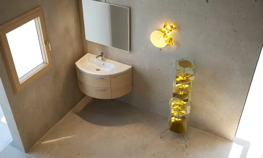 Arredo bagno moderno compatto con base curva e piano Top Jolly in Mineralguss.
